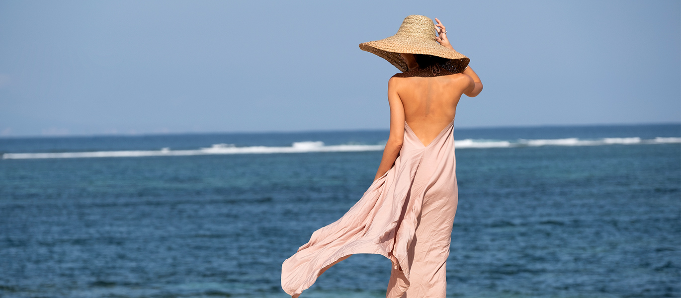 woman at beachfront Bali Benoa Holiday Inn